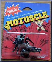 He-Man / Teela / Man-At-Arms (Black) from Masters of the Universe - M.O.T.U.S.C.L.E. manufactured by Super7 [Front]